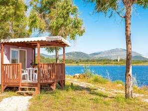 Water, Sky, Property, Swimming Pool, Azure, Cloud, Seaside Resort, Outdoor Furniture, Plant, Tree