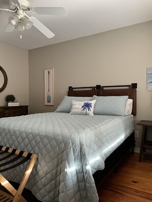 Guest bedroom with blackout curtains, 50” TV and dresser for clothing storage 