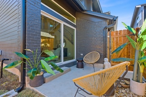 Charming back patio with seating.