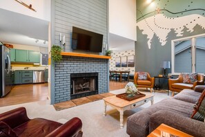 The modern interior boasts stylish finishes and a cozy atmosphere, ideal for relaxing after a day of adventure. 