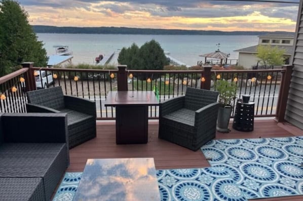 Deck, gas grill, fire pit, kayaks, paddle boards, ladder toss game, corn hole, private Crystal Lake access, sandy lake bottom