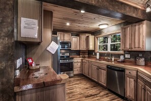 fully stocked kitchen with work space 