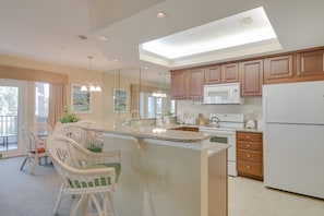 Full kitchen with cooking and dining essentials