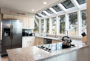 Eat in Kitchen w/ garden house windows overlooking tidal marsh and lagoon