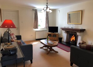 Aughrim Holiday Village, Aughrim, County Wicklow. Open fire, cosy carpeted living room. Elegant furnishing.