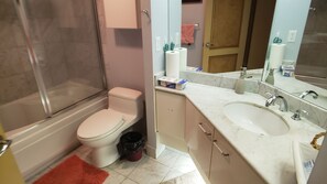Luxurious Bathroom Oasis: Well-Lit and Equipped with a Relaxing Jacuzzi Tub