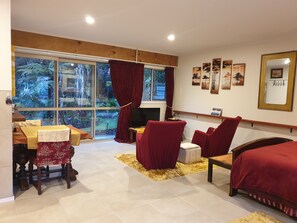 View from kitchen to lounge area and back tropical garden.