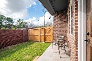 Private backyard that can be accessed from all bedrooms. Outdoor furniture is different from the above staging