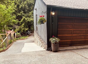 Park in the driveway. take the easy steps down on the left side of the garage.