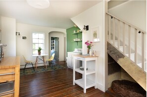 View of the kitchen to the pantry and back door.