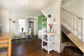 View of the kitchen to the pantry and back door.