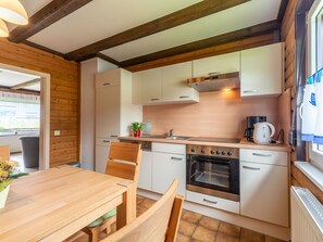 Cabinetry, Countertop, Furniture, Property, Kitchen, Kitchen Appliance, Kitchen Stove, Table, Wood, Home Appliance