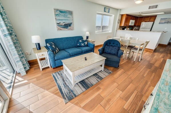 - Bright and airy coastal inspired living space with plush seating - Open floor plan seamlessly connects the living, dining, & kitchen areas for easy gatherings - Enjoy a relaxing evening with a smart TV, cozy décor, & ocean breezes from the balcony