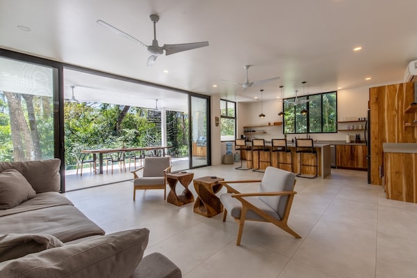 Open kitchen / living area with sliding doors to outside covered patio