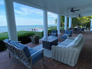 Bay/pool front lounge with fire table
