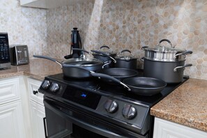 Brand new induction stove with an 11 piece cookware set.