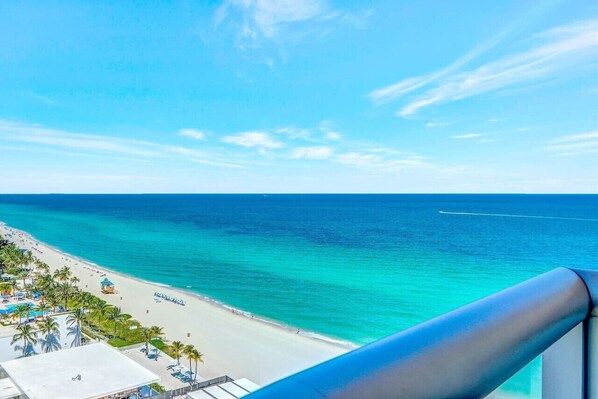 Breathtaking balcony views of the pristine beach and endless sea.