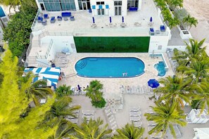 Dive into paradise! Our stunning pool, just a stone's throw from the beach.
