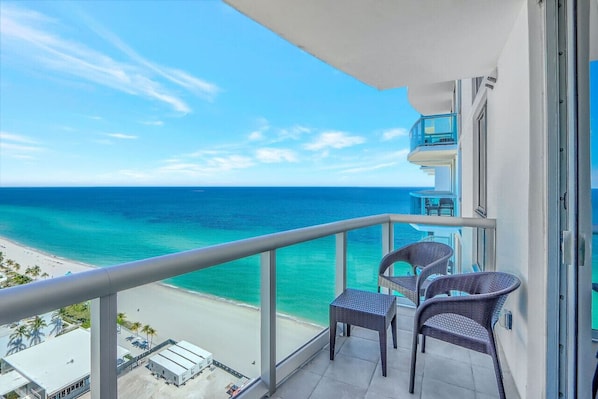 Breathtaking balcony views of the pristine beach and endless sea.