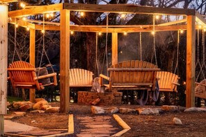 Tell me S'more stories by our cozy firepit, complete with string lights to set the mood!