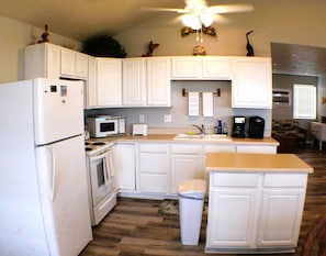 Fully equipped kitchen connected to the living area. Cook while you entertain!