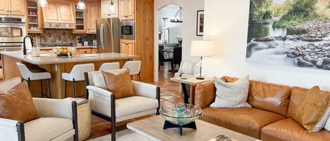 Family Room-open to kitchen and views of outside patio/ pool.