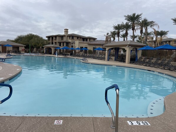Large heated pool (85 degrees) area with lounge chairs and large hot spa!