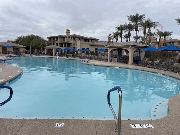 Large heated pool (85 degrees) area with lounge chairs and large hot spa!
