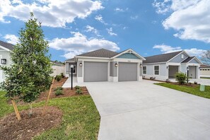 Front of House, showing two car garage. 