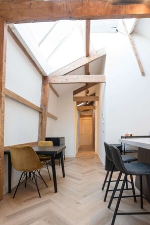 A small dining table is available next to the kitchen for a comfortable sit down meal