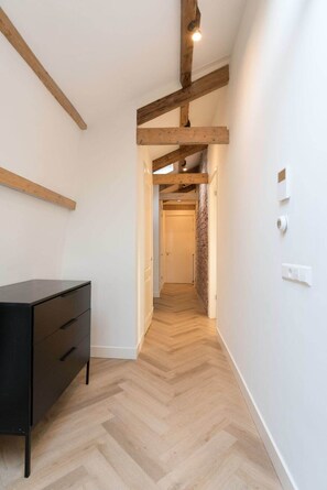 The hallway to the bedroom and bathroom feature a small dresser which you can use to store your stuff