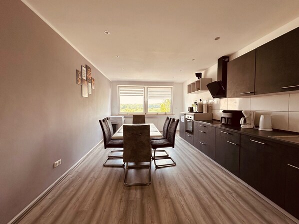Kitchen, stove, oven, filter coffee machine, dishwasher, table, 6 chairs, refrigerator, heating (1)