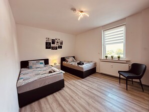 Sleeping 2, 2 single boxspring beds, wardrobe, armchair (1)