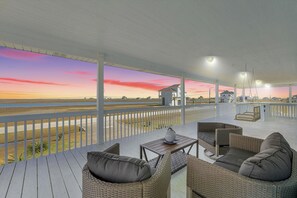 Enjoy sweeping, unobstructed bay front views as you enjoy your morning coffee