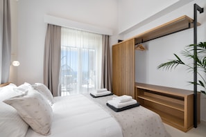 Double Bedroom with patio doors out to poolside 