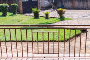 Large lawn with spacious secure parking.