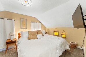 Snuggle under the covers of a King Bed w/ romantic soft lighting, 43" Roku TV
