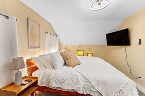 Snuggle under the covers of a King Bed w/ romantic soft lighting, 43" Roku TV
