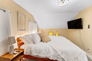 Snuggle under the covers of a King Bed w/ romantic soft lighting, 43" Roku TV