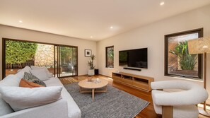 Living area with smart tv and courtyard access 