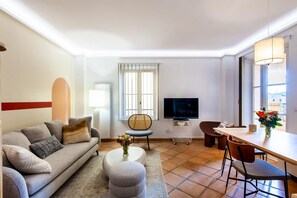 Comfortable living room with convertible sofa, TV