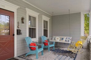 Enjoy coffee on the front porch overlooking the front yard. 