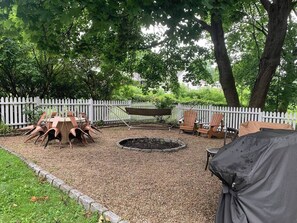 Backyard with hammock, BBQ, plenty of seating for enjoying outside. 