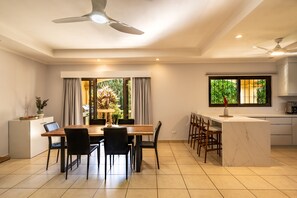 Dining area with open kitchen.