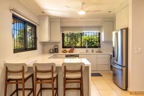 Kitchen with bar counter.