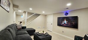 TV room downstairs.  65" TV and a large sectional couch for the gang.  Watch the game or your favorite show.