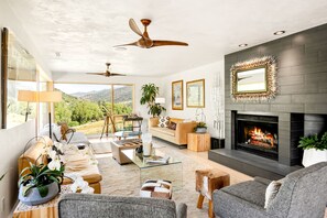 Spacious upstairs living room with gas fireplace