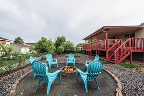 A cozy outdoor fire pit surrounded by comfortable seating plus a s'mores kit!