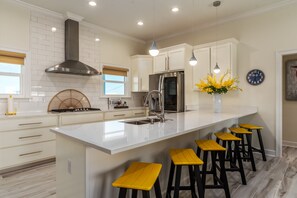 Fully stocked and clean kitchen. Cook for your guests during your Dauphin Island vacation!