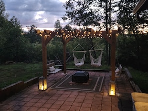 Sunset view of Pergola at front of cabin